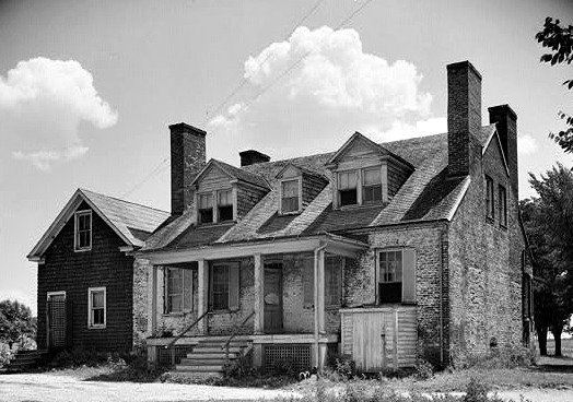 Here the chimneys are bot exterior and interior.  They share the exterior wall, but intrude into the interior space.  Notice how the chimney placement adds to the overall symmetry and seems to pin the house down.  This house would look less substantial absent the chimneys.