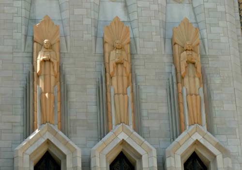 Art Deco statues that stand high above the entrance to Boston Avenue Methodist