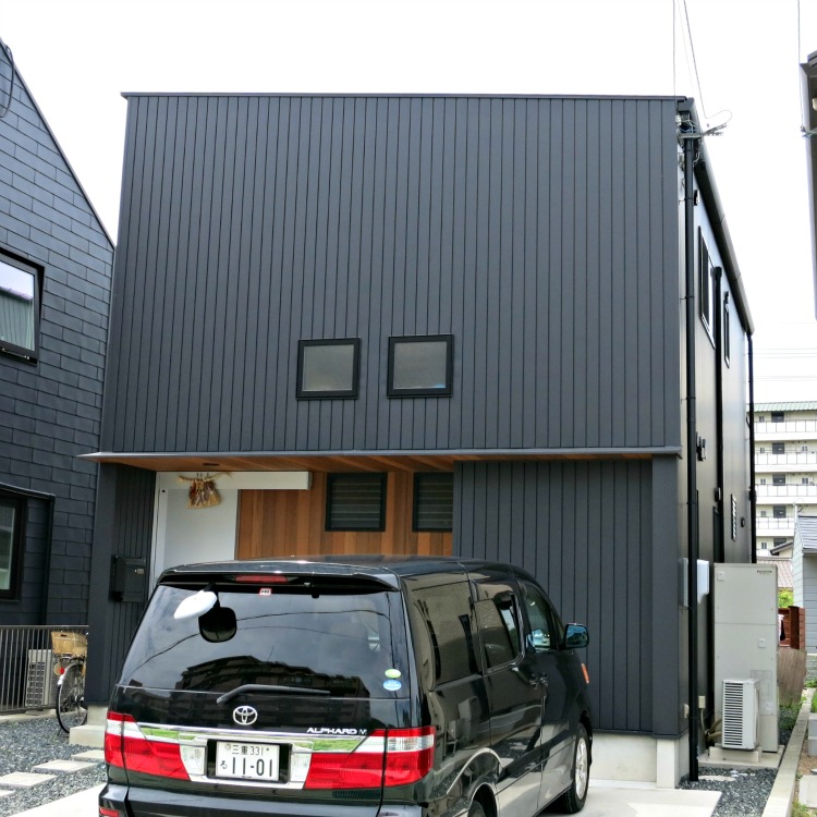 A Japan home with vertical metal siding.  This house is exceptionally boring and must be very dark inside.