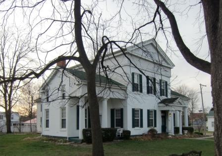 This home started out as a simple Cape Cod but the builder transformed it into a Greek Revival mansion to lure his bride to the wilds of Michigan.