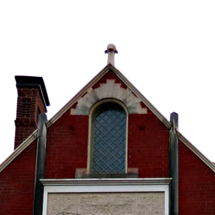 Something as small as a finial viewed from a distance could be a lost detail, except that the lines of the gable draw your attention to the finial.