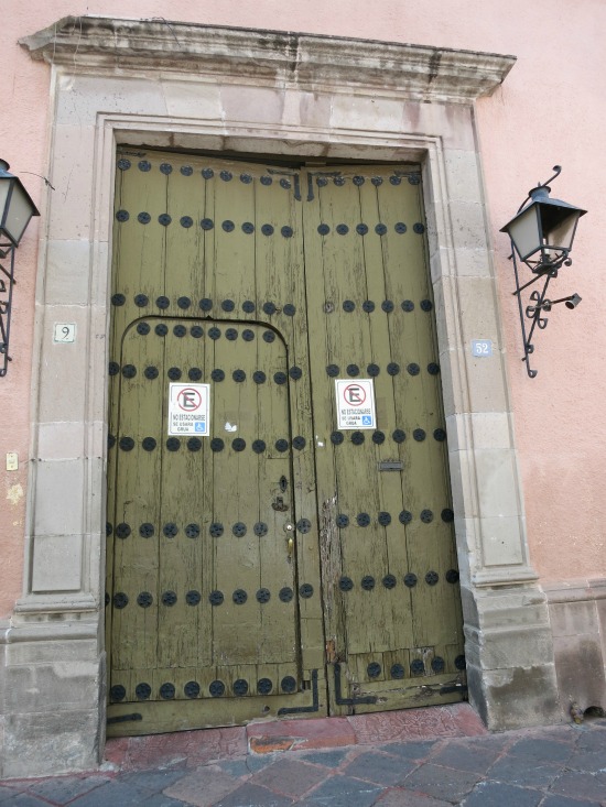 A door-whithin-a-door in the old city area of Queretaro, Mexico.