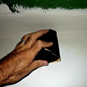 Sanding drywall with a foam block