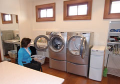 Good laundry room ideas include ergondynamically elevated front-loading washer and dryer - this makes it accessible for everyone