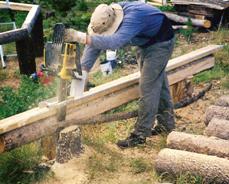 Jon milling the logs with a chainsaw.