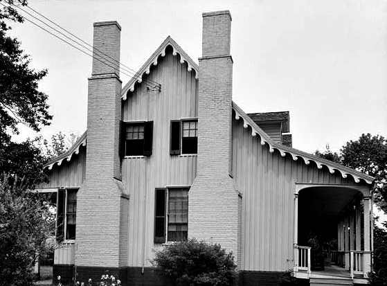 Tidewater home with two chimneys crowding the windows