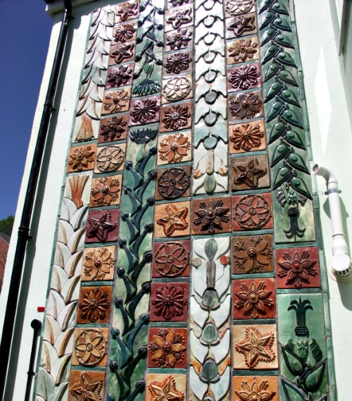 This is an exterior wall of Kay Aplin's Ceramic House.  Those are Tiles.