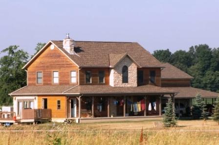 A log home south of Logan County on Hwy 245