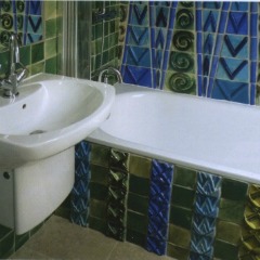 Ceramic Artist Kay Aplin went all out with this bathroom tile design using custom tiles