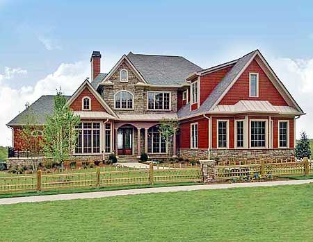 A red house with a stone covered core.