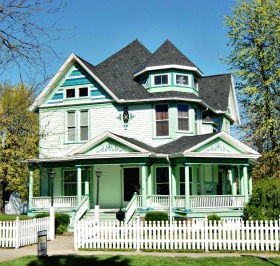 White may be the dominant color but its the greens that give this Queen Anne home its flavor.  Ada, Ohio.