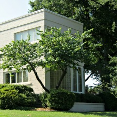 Art Deco home showing glass block framing a bay window. (Hint: Look in the shadows).