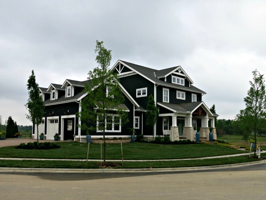They call this Coastal themed - it is Craftsman details on a Foursquare body with shingle siding.