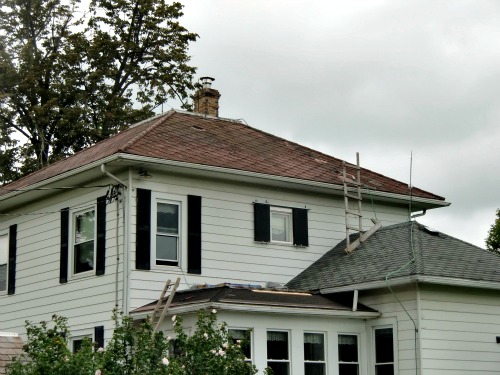 DIY Roofing - Work has begun on the lower roof, but not on the middle roof