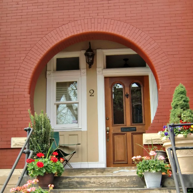 A porch of this size has limited value as a sitting area, there isn't enough depth or breadth, but it is perfect as a protected door stoop. Not only will they be dry, but they will be out of the wind.