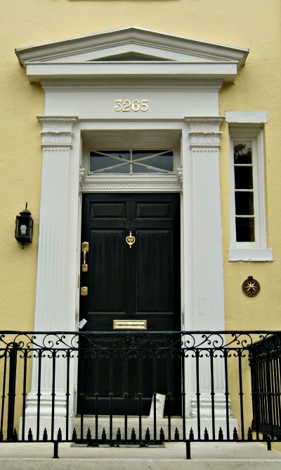 A classical pediment and pilasters runs the risk of looking overdone, but here the builder opted for simplicity.