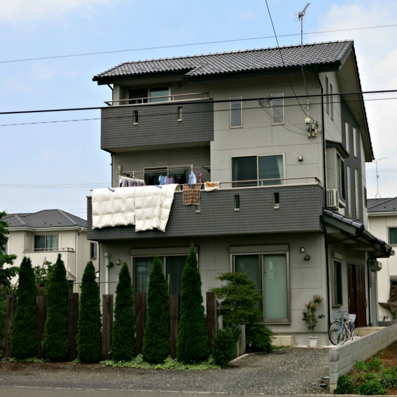 Three story homes are a little unusual, but otherwise this house resembles its neighbors.  The strong emphasis on shapes and mass is typical of the modernist tendencies of Japanese architecture.