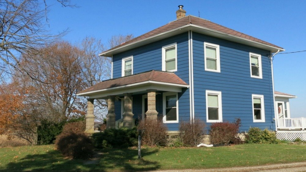 My house after I painted the aluminum siding blue