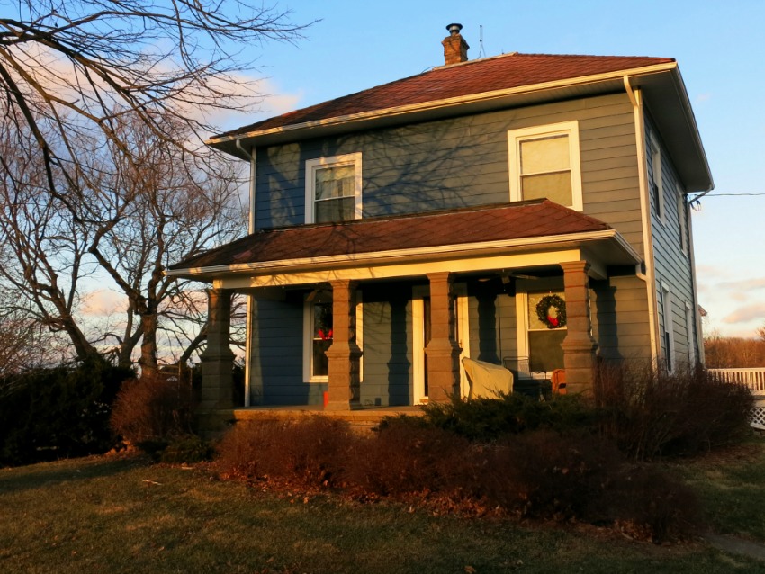 My blue house with painted aluminum siding in Winter