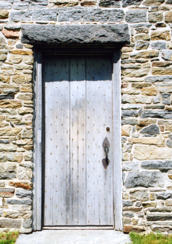 A rustic house deserves a rustic door, and this one delivers.