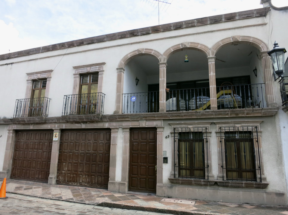 This balcony is a loggia, open and defined on one side by columns