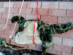 DIY Roofing Safety Harness - The chain near the glove is my tie in to the wall, courtesy a deck screw and a large washer