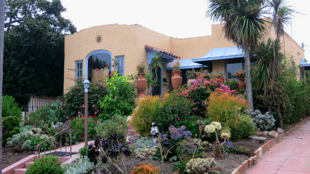 The creation of a small courtyard, even if not much bigger than the entryway, makes a small private garden space.