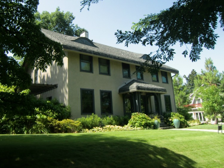 Eyebrow windows sometimes create interest, but also softens the squared off lines of a house.