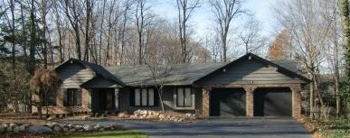 On the North Shore of the bay at Holland, Michigan stands this lovely Ranch - yes I actually like it despite the garage doors and it being a ranch style home