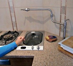 The Gaggenau steamer has an electrically controlled drain valve.  The spigot above is used to fill the steamer.