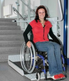 A wheelchair platform lift demonstrated - photo courtesy of Savaria.com